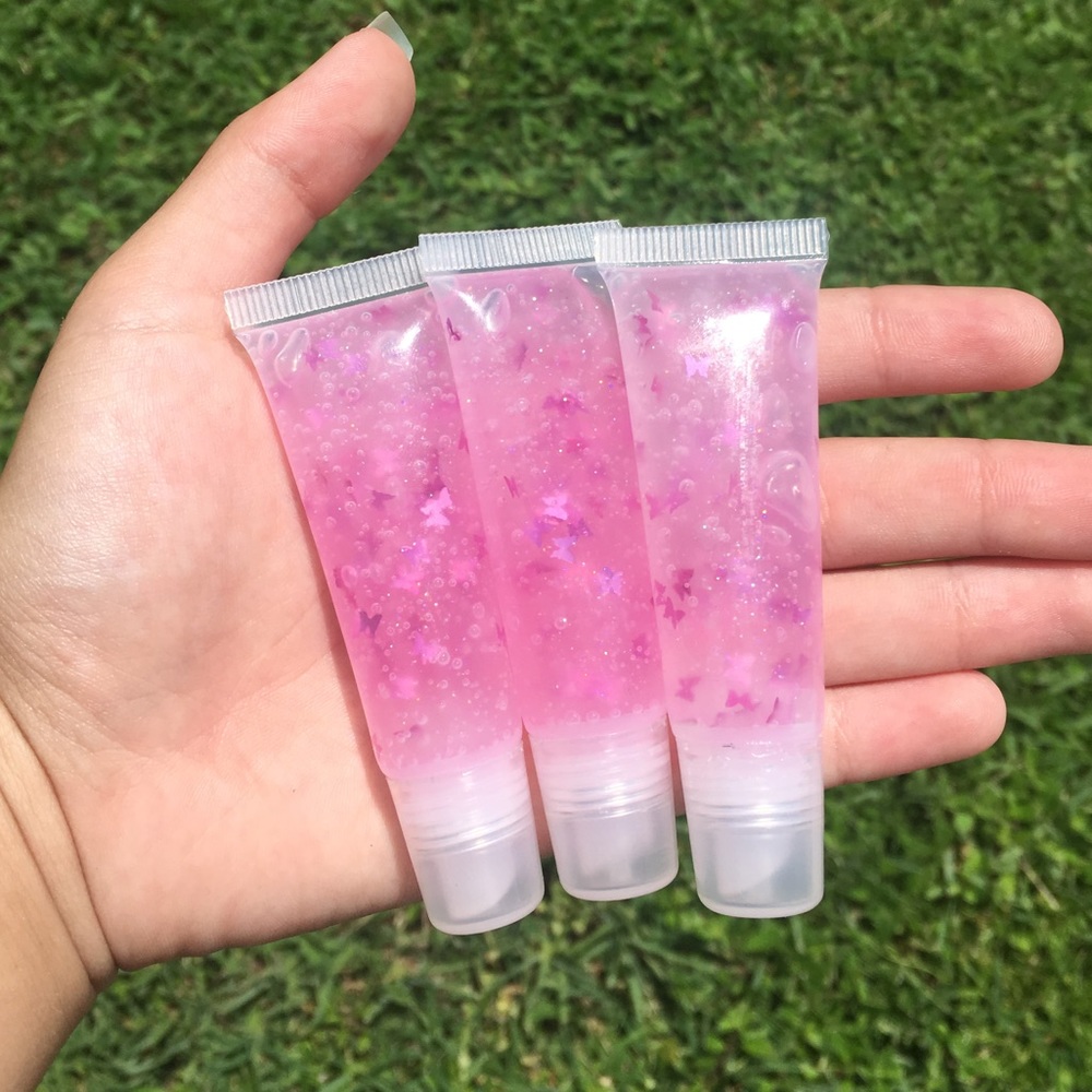 lunagloss purple-tinted lipgloss with butterflies